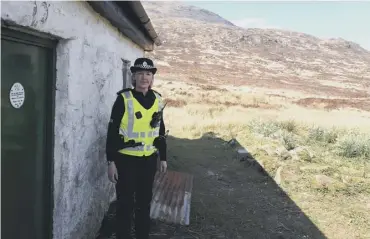  ??  ?? 0 PC Samantha Briggs outside the bothy at Tunskeen in the Galloway Forest Park