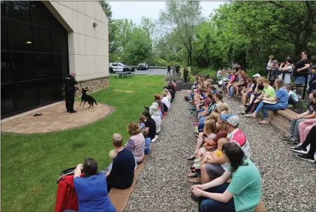  ?? SPECIAL TO MEDIANEWS GROUP — JEFF DOELP ?? Exeter Township police Officer Joseph Ilg does a presentati­on May 13with his K9partner Iko at the Exeter Community Library’s new outdoor space.