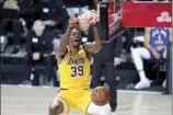  ?? AP photo ?? Lakers center Dwight Howard dunks during the second half of Los Angeles’ win over the Denver Nuggets on Friday.