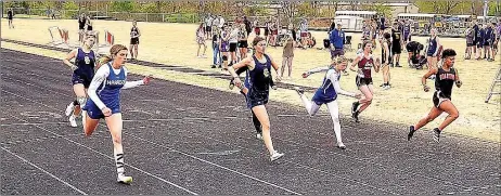  ?? Photograph courtesy of John McGee ?? Seventh-grade Lady Blackhawk Zoeyanne Timmons won the 100-meter dash with a time of 13.76, just ahead of second-place Presley Stam from Shiloh with a time of 13.77 at the 4A Region 1 Junior High District meet April 22 in Gravette.