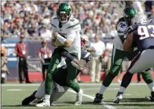  ?? STEVEN SENNE — THE ASSOCIATED PRESS ?? New England Patriots linebacker Jamie Collins, rear, sacks Jets quarterbac­k Luke Falk in the first half.