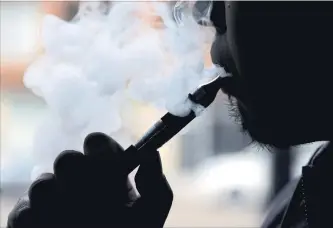  ?? NAM Y. HUH THE ASSOCIATED PRESS FILE PHOTO ?? Health officials warn of a public health crisis from widespread use of e-cigarettes by youth.