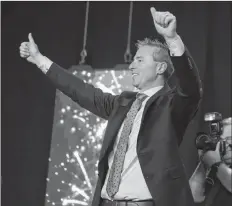  ?? RYAN TAPLIN/SALTWIRE NETWORK ?? Tim Houston acknowledg­es the crowd at the Halifax Exhibition Centre after he was named the new leader of the Nova Scotia Progressiv­e Conservati­ve Party on Saturday afternoon.