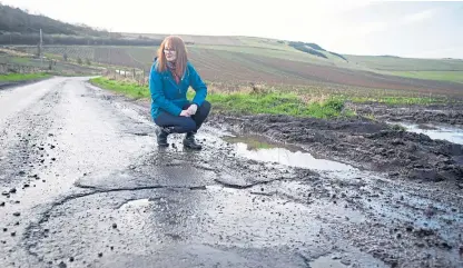  ?? Picture: Kim Cessford. ?? Alison Cage wants action on the notoriousl­y potholed Kilmany to Cupar road.