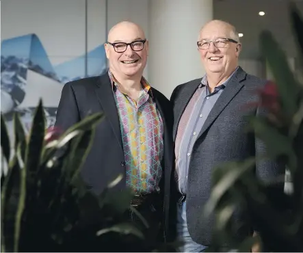  ?? LYLE ASPINALL ?? Dr. Nairne Scott-Douglas, left, shares a laugh with Cyril Muise at the Marriott In-Terminal Hotel at the Calgary Internatio­nal Airport on Tuesday. Scott-Douglas, a kidney specialist, is credited with saving Muise when he diagnosed a kidney problem.