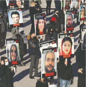  ?? CHRIS YOUNG / THE CANADIAN PRESS ?? Placards in Toronto on Friday reflect heavy hearts a calendar year after the Iran Air
crash. More than 100 of the 176 victims had ties to Canada.