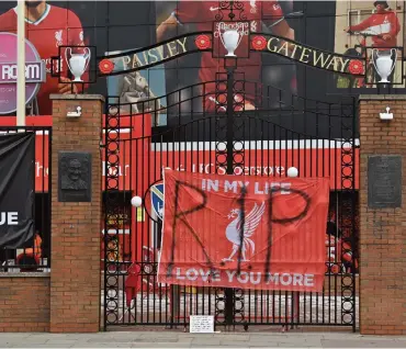  ?? (AFP) ?? Banners critical of the European Super League (ESL) project hang from the railings of Anfield stadium, home of Liverpool club, in UK, on Wednesday. The proposed ESL appeared dead in the water after nine of the 12 clubs withdrew following a backlash from fans and threats from football authoritie­s