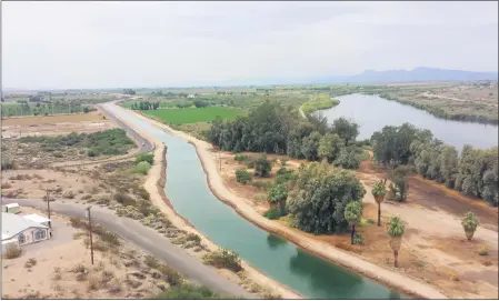  ?? ANGIE INGRAM — CRIT WATER RESOURCES VIA AP ?? A canal system on the Colorado River Indian Tribes reservatio­n is seen near Parker, Ariz. The tribe has played an outsized role in Arizona to help keep Lake Mead from falling to drasticall­y low levels. Arizona is expected to face the first-ever mandatory cuts to its Colorado River water supply in 2022.