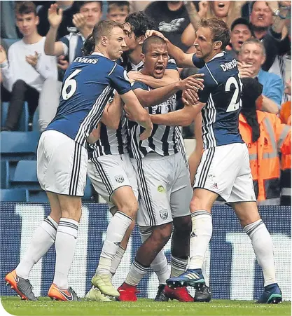  ??  ?? Salomon Rondon is mobbed by his West Brom team-mates following his late equaliser at The Hawthorns