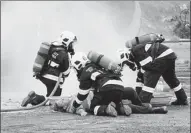  ??  ?? Employees drill to rescue injured colleagues at the Paddington Operations owned by Zijin Mining in Australia.