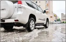  ?? Photo by Mohammad Morsi ?? Kuwait was hit by sporadic, intermitte­nt rain throughout the country which began Tuesday evening. Pools of water slowed down traffic with people preferring to stay indoors. More rain is expected as unstable weather to continue over the weekend, says the weatherman.