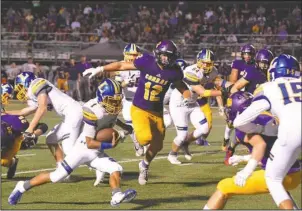  ?? The Sentinel-Record/Grace Brown ?? RUSHING RAM: Lakeside sophomore Issac Echols (1) breaks free last Friday night as Fountain Lake senior Colson Simpson (12) defends. Echols finished with 19 carries for 113 yards to lead the Ram offense.