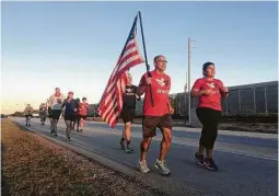  ?? St. John Barned-Smith / Houston Chronicle ?? Participan­ts in the Old Glory Relay spent Friday running from Lissie to Richmond. The relay will pass through Houston over the weekend.