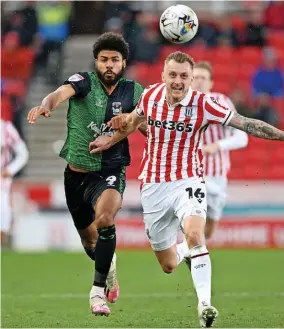  ?? ?? Stoke City defender Ben Wilmot battles with Coventry striker Ellis Simms.