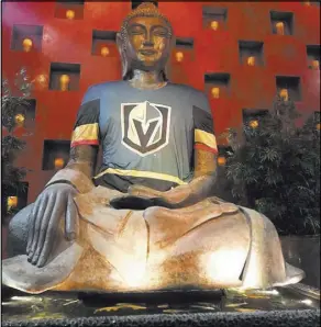  ?? Tao Las Vegas ?? The buddha at the entrance of Tao at The Venetian wears his new Vegas Golden Knights jersey.