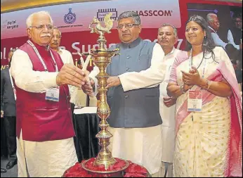  ?? HT PHOTO ?? Union minister Ravi Shankar Prasad and chief minister Manohar Lal Khattar inaugurati­ng the Digital Haryana Summit in Gurgaon on Friday as state minister Kavita Jain looks on.