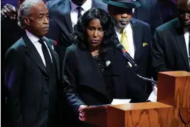  ?? Photograph: AFP/Getty
Images ?? RowVaughn Wells, flanked by Al Sharpton, left, and her husband, Rodney Wells, at the funeral service for her son, Tyre Nichols, in Memphis, Tennessee.