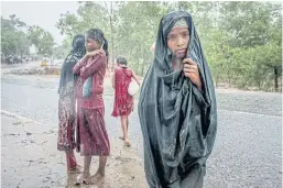  ??  ?? DISPLACED: Rohingya children near the Kutupalong refugee camp, Bangladesh, left.