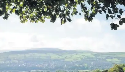  ?? Tim Nuttall ?? ●● The view to Cowpe Lowe, the last challenge on the longer Round The Hills Walk pictured from above Ski Rossendale