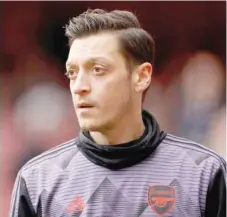  ?? — Reuters ?? Arsenal’s Mesut Ozil during the warm up before the match.