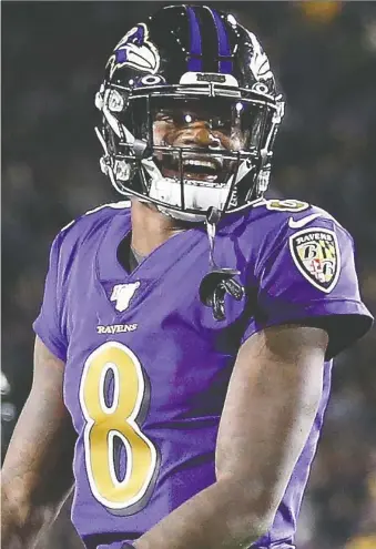  ?? SEAN M. HAFFEY/GETTY IMAGES ?? Ravens QB Lamar Jackson grins during Monday night’s destructio­n of the Rams. Jackson was the first player in NFL history to throw five TD passes in his Monday Night Football debut.