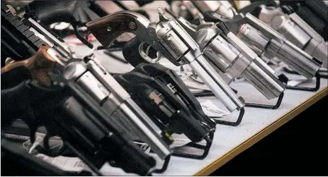  ?? RUTH FREMSON/THE NEW YORK TIMES PHOTOS ?? According to national health statistics, 24,432 Americans used guns to kill themselves in 2018, an increase of almost 26% from figures in 2010. Above, handguns in Washington state.