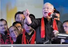  ?? — AFP ?? Malaysian Prime Minister Najib Razak addressing ethnic Rohingya refugees during a gathering in Kuala Lumpur on Sunday.