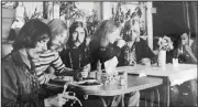  ?? (AP) ?? Members of the Allman Brothers Band — Dickey Betts (from left), Duane Allman, Berry Oakley, Butch Trucks, Gregg Allman and Jai Johanny “Jaimoe” Johanson, grab a meal in Macon, Ga., in this undated photograph.