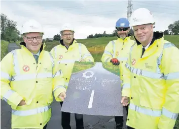  ??  ?? New journey Glenboig councillor­s Michael McPake and Willie Doolan, left, at the site of the link road work