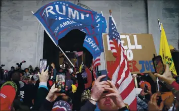  ?? JOHN MINCHILLO — THE ASSOCIATED PRESS ?? Trump supporters gather outside the U.S. Capitol on Jan. 6 in Washington.