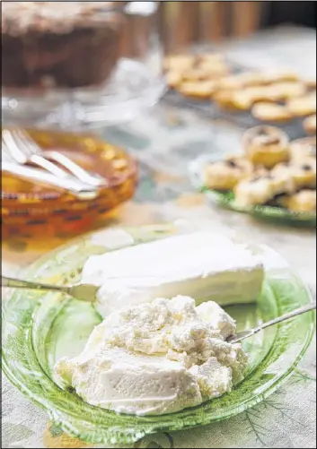  ?? STYLING BY C.W. CAMERON / PHOTO BY RENEE BROCK/ SPECIAL ?? Cream cheese and its softer counterpar­t Neufchâtel can add tanginess to fillings, frostings and cakes.