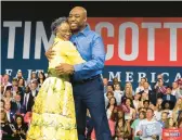  ?? MIC SMITH/AP ?? GOP presidenti­al candidate Sen. Tim Scott hugs his mother, Frances Scott, Monday after announcing his candidacy for U.S. president in North Charleston, S.C.