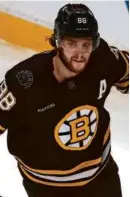  ?? JOHN TLUMACKI/GLOBE STAFF ?? David Pastrnak scored three points on the day he earned a fourth All-Star berth.