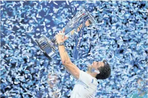  ?? REUTERS ?? Grigor Dimitrov celebrates with the trophy after winning the ATP Finals in London on Sunday.