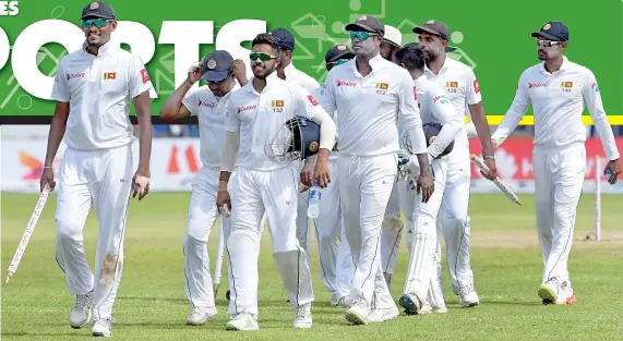  ??  ?? Skipper Suranga Lakmal leads the victorious Lankan team with over two days play remaining in the first Test at Galle yesterday. South Africa were skittled for their lowest score yesterday since re-admission to Test cricket - Pix by Amila Gamage