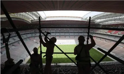  ?? Photograph: Kamran Jebreili/AP ?? Workers remove scaffoldin­g at the Al Bayt stadium in Al Khor, which will host the World Cup opener in two weeks’ time.