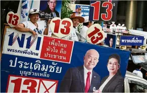  ?? — AFP ?? Lucky 13: Pheu Thai party supporters campaignin­g in Bangkok on the eve of the general election.