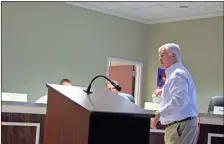  ?? kevin Myrick ?? Wes Hulsey explains the different types of sludge and how it is processed to the Polk County Commission during a July 31 work session.