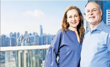  ??  ?? HELLO, DUBAI: Jean Candiotte and husband Barry Greenberg, here at their Dubai home, say they left the emirate in 2017 to escape anti-Semitism but have returned to a changed environmen­t. Rabbi Elie Abadie (right) says the treaty with Israel prompted him to leave his Manhattan home for Dubai.