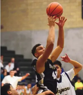  ?? ADOLPHE PIERRE-LOUIS/JOURNAL ?? Volcano Vista’s David Cormier grabs a rebound during the Hawks’ win over Atrisco Heritage Tuesday.