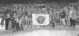  ?? REPUBLIC
MEGAN MENDOZA/THE ?? The Alchesay High School girls basketball team poses for a photo after winning the 3A state final at the Arizona Veterans Memorial Coliseum.