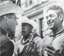  ?? Associated Press file photo ?? The Rev. Antonio Gonzalez, left, a Catholic priest from Houston, speaks with marchers in Austin after their 1966 trek.