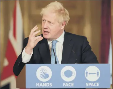  ?? PICTURE: ANDREW PARSONS/ NO 10 DOWNING STREET ?? RULING NOTHING OUT: Boris Johnson at yesterday’s Covid- 19 press conference at Downing Street.