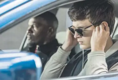  ??  ?? Ansel Elgort and Jamie Foxx in “Baby Driver.”