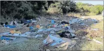  ?? Picture: SUPPLIED ?? EYESORE: An illegal dumpsite was forming along Beaconhurs­t Drive in the suburb of Beacon Bay, until it was set alight by unknown people yesterday, after the photograph was taken