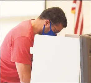  ?? Tyler Sizemore / Hearst Connecticu­t Media ?? Greenwich's Eric Barrow votes in the special election at the District 7 and 8 polling center at Central Middle School in Greenwich on Tuesday.