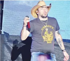  ??  ?? Jason Aldean, the Sunday night headliner, had just taken the stage when bursts of gunfire rang out, sending thousands of people diving for cover.