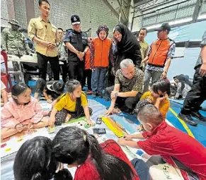  ?? ?? Help where it’s needed: deputy Prime Minister datuk Seri Fadillah yusof visiting flood victims at the Serian Indoor Stadium.