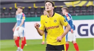  ?? Associated Press ?? ↑
Dortmund’s Giovanni Reyna celebrates after scoring against Holstein Kiel during their German Cup semi-final on Saturday.