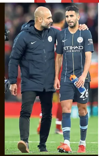  ?? — Reuters ?? Tough luck: Manchester City manager Pep Guardiola consoling Riyad Mahrez after the latter missed a penalty during the Premier League match against Liverpool on Sunday.